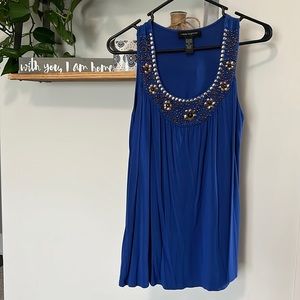 Woman’s blue, beaded tank top